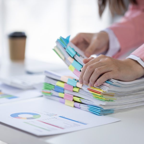 Business asian woman signs an electronic document on a digital document on a virtual laptop computer